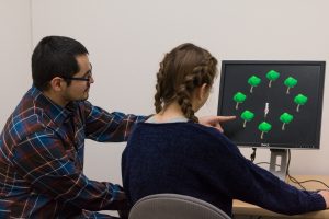 Participant engaging in computer lab activity with lab staff